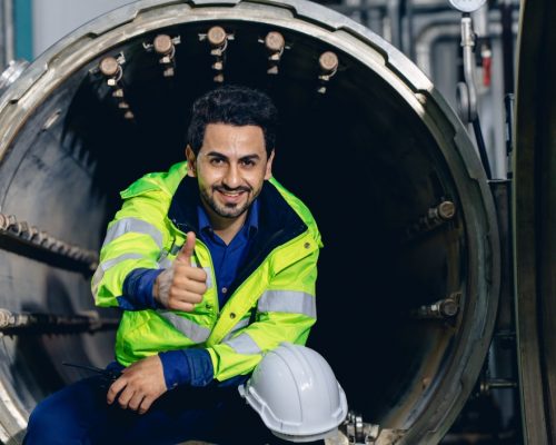 portrait-engineer-worker-happy-smiling-working-in-factory-sitting-relax-thumbs-up-machinery-gas_t20_OJKwxE